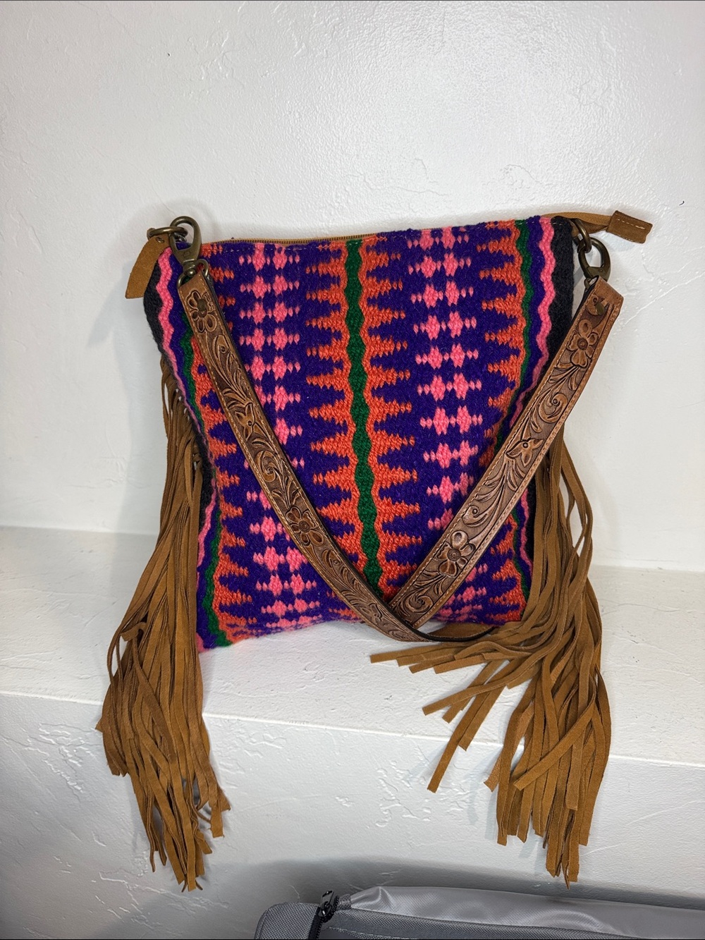 Colorful knitted saddle blanket crossbody bag